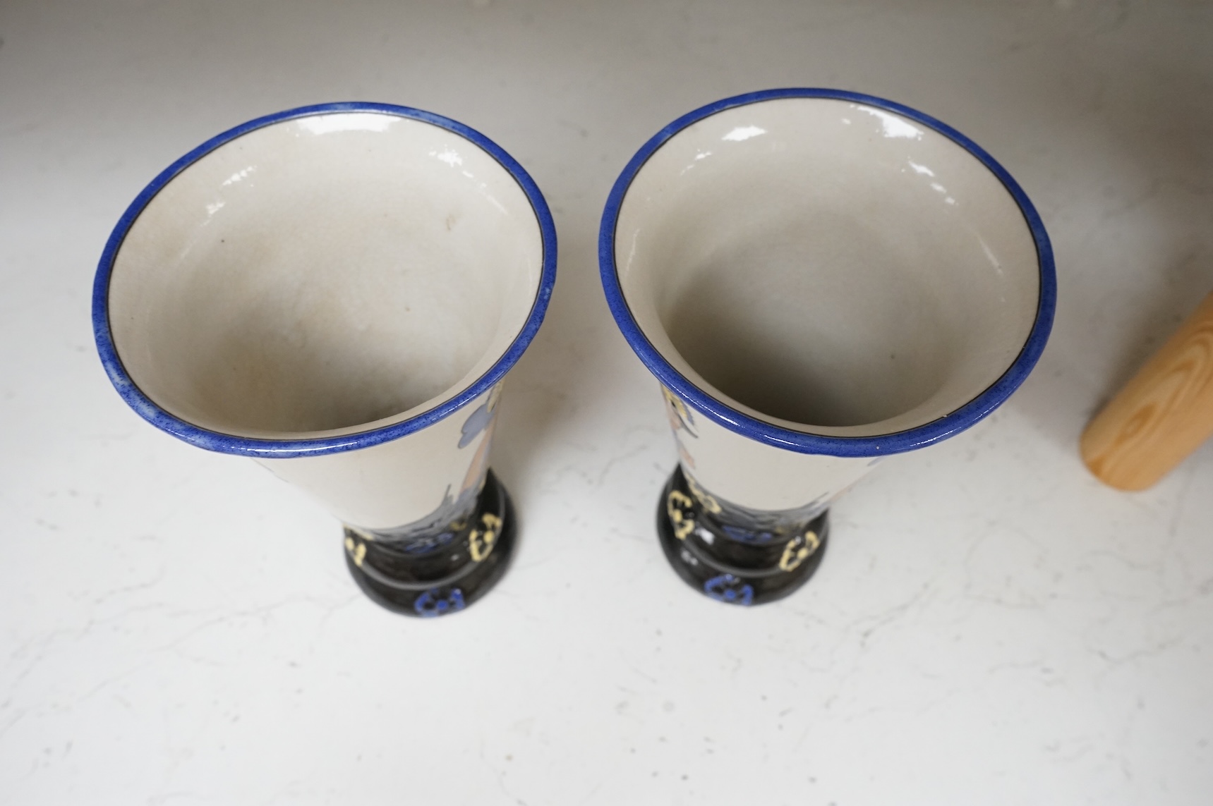 A pair of Longwy style 'flapper lady' pottery vases